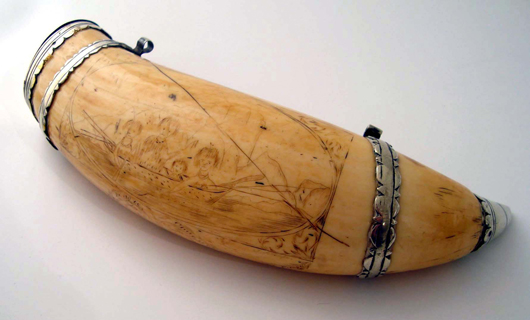 View of scrimshawed whale tooth from historic Darwin voyage. Image courtesy Adam Partridge Auctioneers.